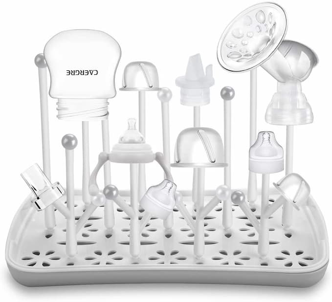 Parts of baby bottle on drying rack