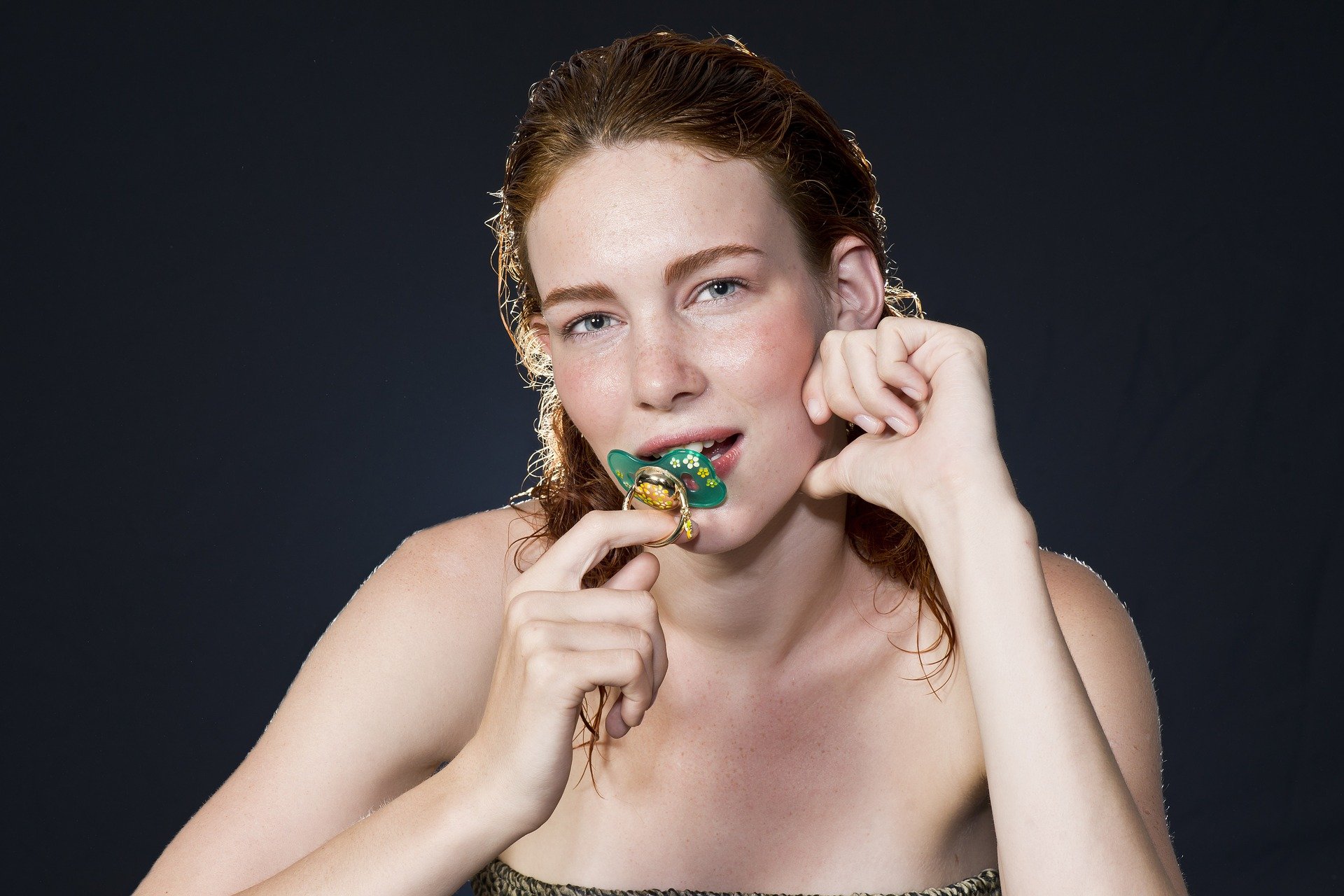 model with pacifier in mouth